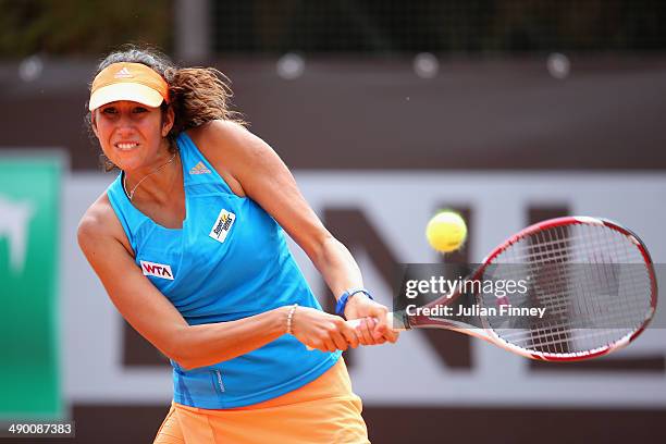 Nastassja Burnett of Italy in action against Garbine Muguruza of Spain during day three of the Internazionali BNL d'Italia tennis 2014 on May 13,...