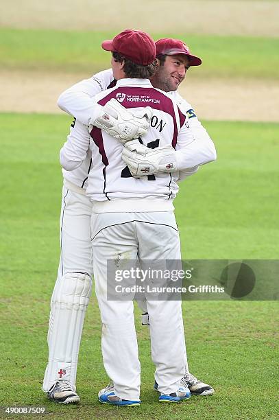 Robert Newton of Northamptonshire is congratuated by David Murphy on catching Samit Patel of Nottinghamshire during day three of the LV County...