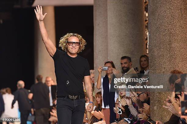 Designer Peter Dundas aknowledge the applause of the public after the Roberto Cavalli show as a part of Milan Fashion Week Spring/Summer 2016 on...