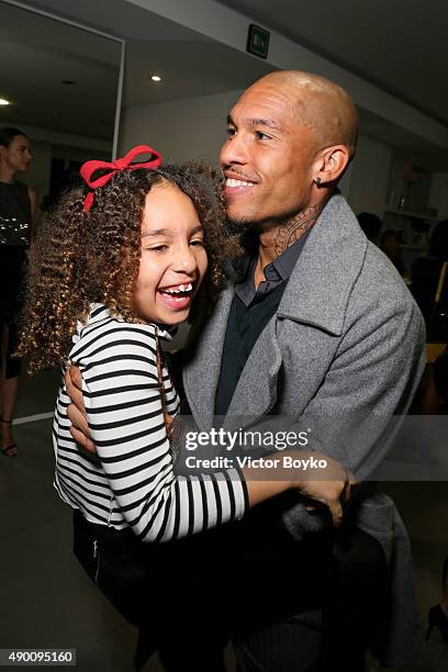 Nigel de Jong and daughter attend the Winonah cocktail party during the Milan Fashion Week Spring/Summer 2016 on September 25, 2015 in Milan, Italy.