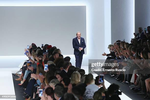 Designer Ermanno Scervino acknowledges the audience at the end of the Ermanno Scervino fashion show as part of Milan Fashion Week Spring/Summer 2016...