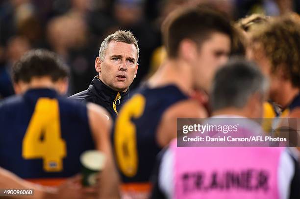 Adam Simpson, coach of the West Coast Eagles addresses the team at three quarter time during the 2015 AFL Second Preliminary Final match between the...