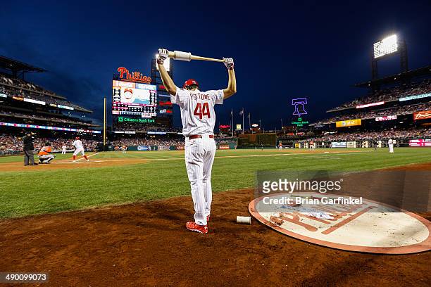 Jonathan Pettibone of the Philadelphia Phillies prepares to bat in the on deck area during the game against the Miami Marlins at Citizens Bank Park...