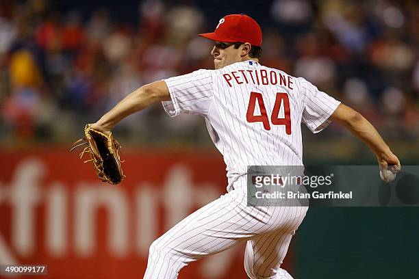 Starting pitcher Jonathan Pettibone of the Philadelphia Phillies throws a pitch during the game against the Miami Marlins at Citizens Bank Park on...