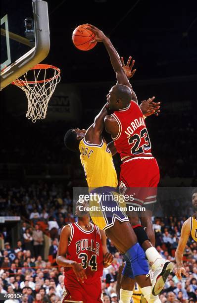 Michael Jordan of the Chicago Bulls dunks the ball during a game against the Los Angeles Lakers.