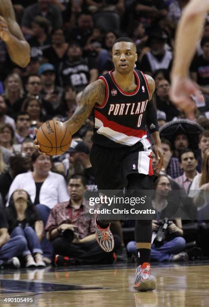 Damian Lillard of the Portland Trail Blazers brings the ball up court against the San Antonio Spurs in Game Two of the Western Conference Semifinals...