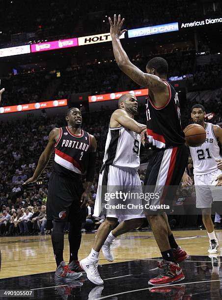 Tony Parker of the San Antonio Spurs passes around LaMarcus Aldridge of the Portland Trail Blazers in Game Two of the Western Conference Semifinals...