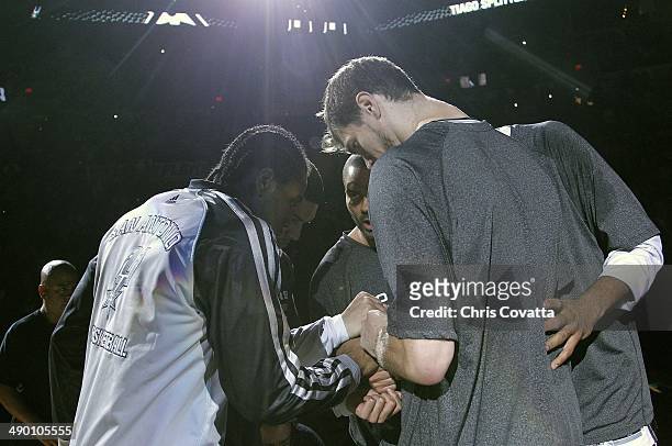The San Antonio Spurs huddle up before playing against the Portland Trail Blazers in Game Two of the Western Conference Semifinals during the 2014...