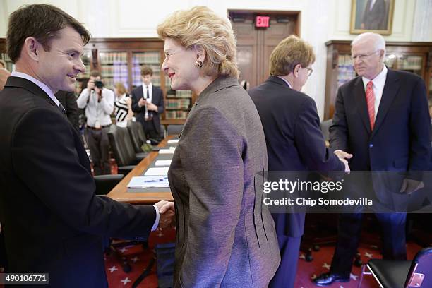 Senate Agriculture Committee Chairwoman Debbie Stabenow greets Massachusetts Institute of Technology Sloan School of Management Finance Professor...