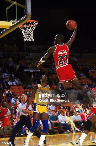 Michael Jordan of the Chicago Bulls dunks the ball during a game against the Los Angeles Lakers.