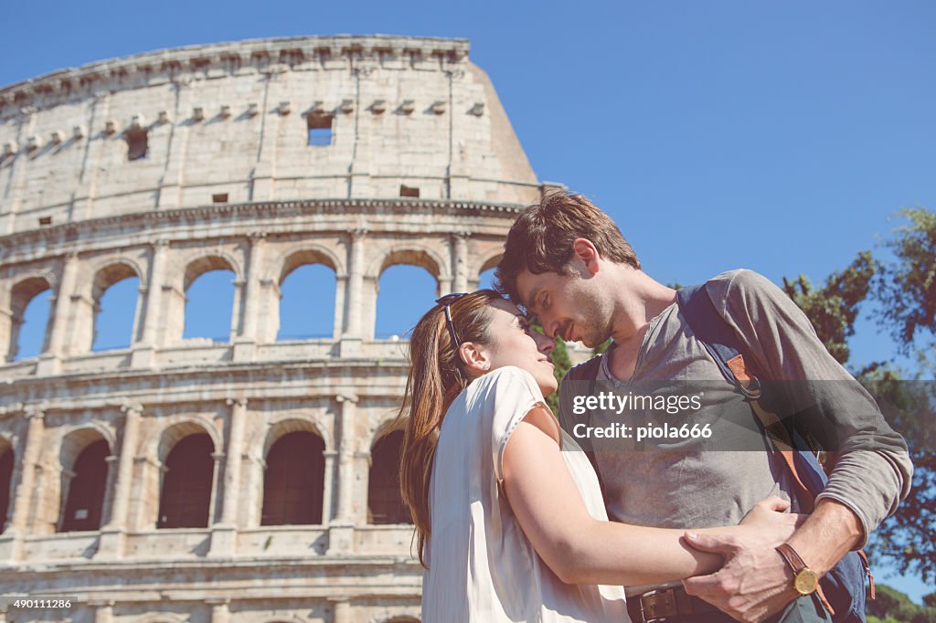 Passionate kiss in front of the Coliseum