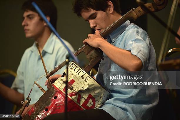 Paraguay's Cateura Youth Orchestra of Recycled instruments play during the Awards Ceremony "Latinoamerica Verde" at the Crystal Palace in Guayaquil,...