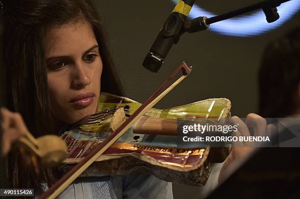 Paraguay's Cateura Youth Orchestra of Recycled instruments play during the Awards Ceremony "Latinoamerica Verde" at the Crystal Palace in Guayaquil,...