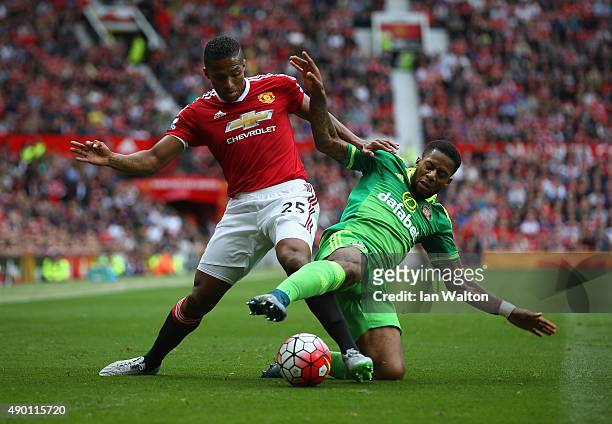 Jeremain Lens of Sunderland and Antonio Valencia of Manchester United compete for the ball during the Barclays Premier League match between...