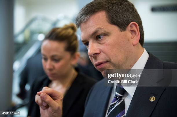 Sen. Mark Begich, D-Alaska, speaks with a reporter in the Capitol following a vote on Tuesday, May 13, 2014.