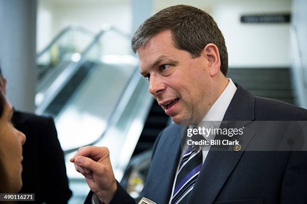 Sen. Mark Begich, D-Alaska, speaks with a reporter in the Capitol following a vote on Tuesday, May 13, 2014.