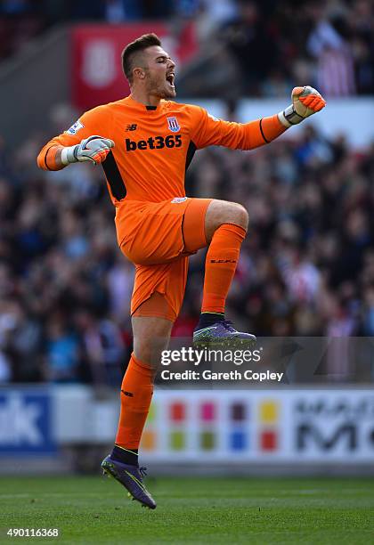 Jack Butland of Stoke City celebrates his team's first goal by Jonathan Walters during the Barclays Premier League match between Stoke City and...