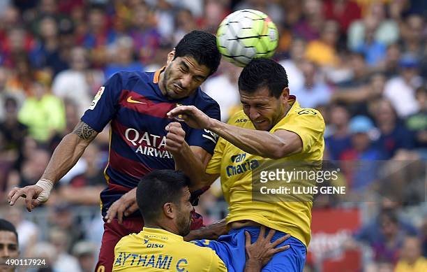 Barcelona's Uruguayan forward Luis Suarez heads the ball to score a goal during the Spanish league football match FC Barcelona vs UD Las Palmas at...