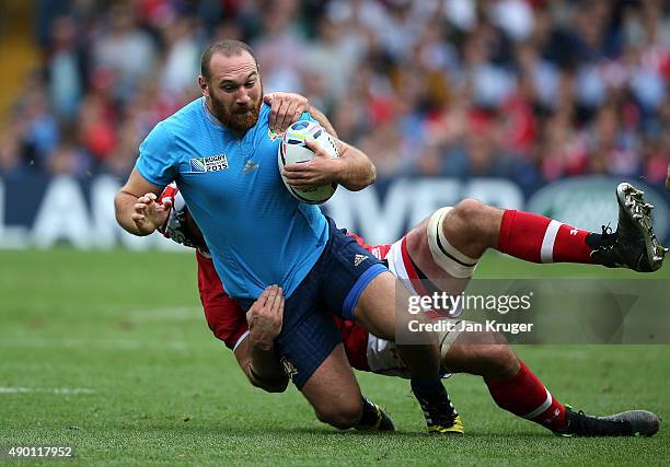 Davide Giazzon of Italy is tackled by Jamie Cudmore of Canada during the 2015 Rugby World Cup Pool D match between Italy and Canada at Elland Road on...