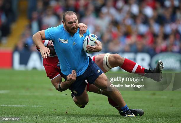 Davide Giazzon of Italy is tackled by Jamie Cudmore of Canada during the 2015 Rugby World Cup Pool D match between Italy and Canada at Elland Road on...