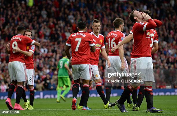 Manchester United's English striker Wayne Rooney celebrates after scoring their second goal during the English Premier League football match between...