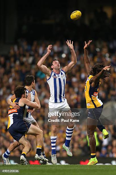 Nic Naitanui of the Eagles and Todd Goldstein of the Kangaroos contest the ruck during the AFL Second Preliminary Final match between the West Coast...