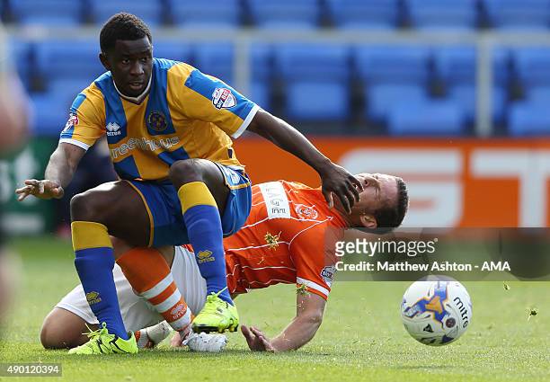 Larnell Cole of Shrewsbury Town and David Norris of Blackpool during the Sky Bet League One match between Shrewsbury Town and Blackpool at New Meadow...