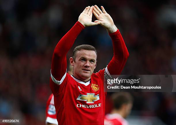 Wayne Rooney of Manchester United celebrates scoring his team's second goal during the Barclays Premier League match between Manchester United and...