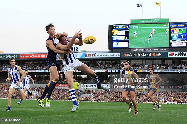 Callum Sinclair of the Eagles and Todd Goldstein of the Kangaroos contest a mark during the AFL Second Preliminary Final match between the West Coast...