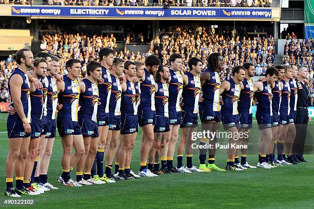 The Eagles line up for the national anthem during the AFL Second Preliminary Final match between the West Coast Eagles and the North Melbourne...