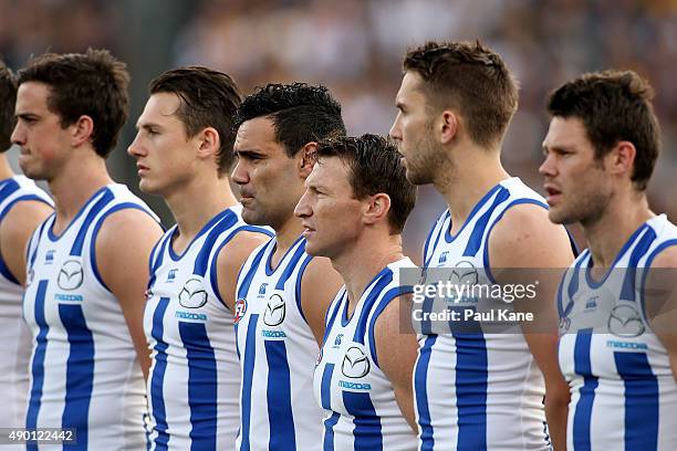 Brent Harvey of the Kangaroos lines up with team mates for the national anthem during the AFL Second Preliminary Final match between the West Coast...