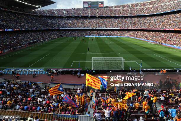 Barcelona's supporters wave "Estelada", pro-independent Catalonia flags, during the Spanish league football match FC Barcelona vs UD Las Palmas at...