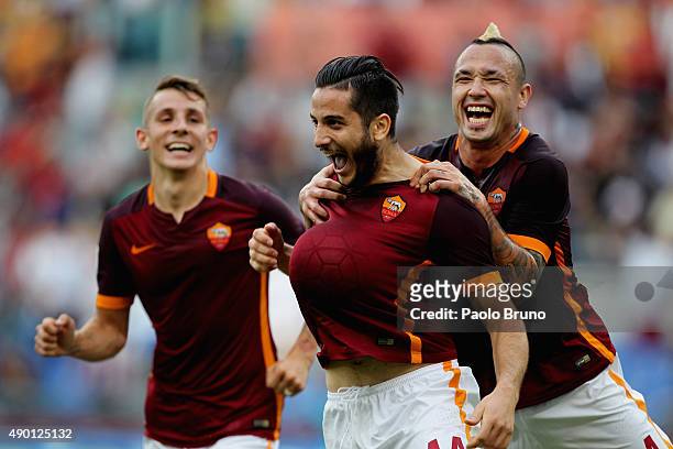 Kostas Manolas of AS Roma celebrates with his teammates Lucas Digne and Radja Nainngolan after scoring the opening goal during the Serie A match...