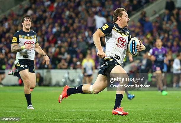 Michael Morgan of the Cowboys runs away to score a try during the NRL Second Preliminary Final match between the Melbourne Storm and the North...