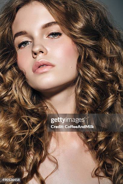 studio shot of young beautiful woman - women flashing stock pictures, royalty-free photos & images