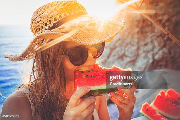 eating and enjoying watermelon - summer refreshment stock pictures, royalty-free photos & images