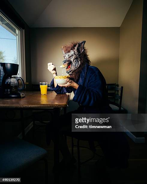 werewolf man eating breakfast on a lazy weekend morning - animal themes stock pictures, royalty-free photos & images