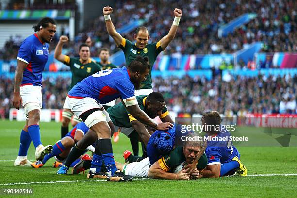 Schalk Burger of South Africa goes over to score his teams third try during the 2015 Rugby World Cup Pool B match between South Africa and Samoa at...