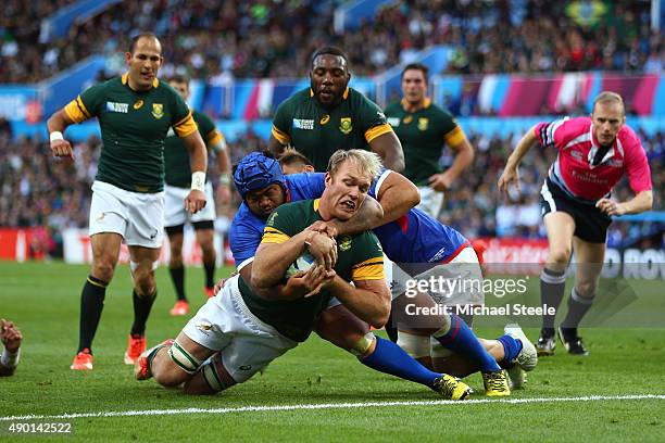 Schalk Burger of South Africa goes over to score his teams third try during the 2015 Rugby World Cup Pool B match between South Africa and Samoa at...