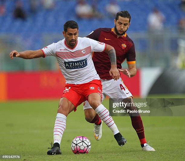 Kostas Manolas of AS Roma competes for the ball with Marco Borriello of Carpi FC during the Serie A match between AS Roma and Carpi FC at Stadio...
