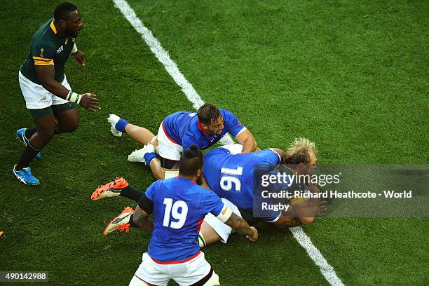 Schalk Burger of South Africa goes over to score his teams third try during the 2015 Rugby World Cup Pool B match between South Africa and Samoa at...