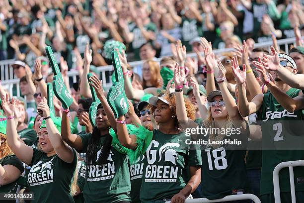 Michigan State Spartans fans cheers on their team during the first quarter of the game against the Central Michigan Chippewas on September 26, 2015...