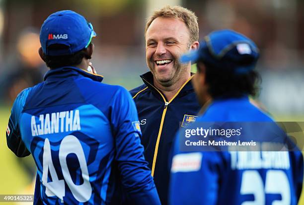 Chris Adams talks to Ajantha Mendis of Sri Lanka, after he is consulting for the Sri Lankan cricket team whilst on the Tour of England during a Tour...