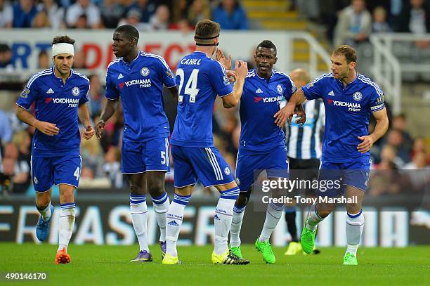 Ramires of Chelsea celebrates scoring his team's first goal with his team mates during the Barclays Premier League match between Newcastle United and...