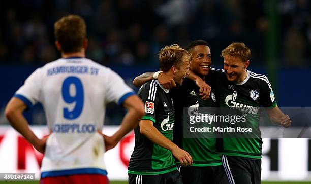 Johannes geis, Dennis Aogo and Benedikt Hoewedes of Schalke celebrate after the Bundesliga match between Hamburger SV and FC Schalke 04 at...