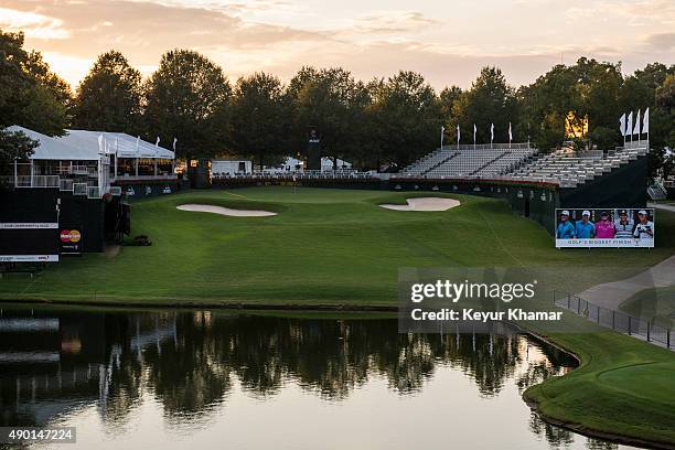 Course scenic view as the sun sets behind the 18th hole green during practice for the TOUR Championship by Coca-Cola, the final event of the PGA TOUR...