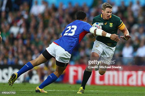 Jean De Villiers of South Africa is challenged by Tusi Pisi of Samoa during the 2015 Rugby World Cup Pool B match between South Africa and Samoa at...