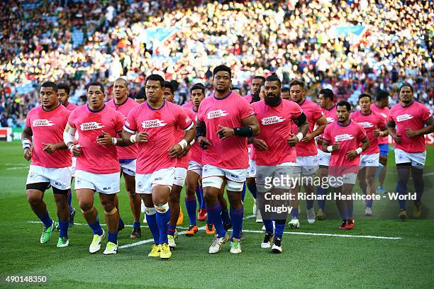 The Samoa team warms up wearing Tackle Doping TShirts during the 2015 Rugby World Cup Pool B match between South Africa and Samoa at Villa Park on...