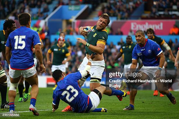 Duane Vermeulen of South Africa is tackled by George Pisi of Samoa during the 2015 Rugby World Cup Pool B match between South Africa and Samoa at...