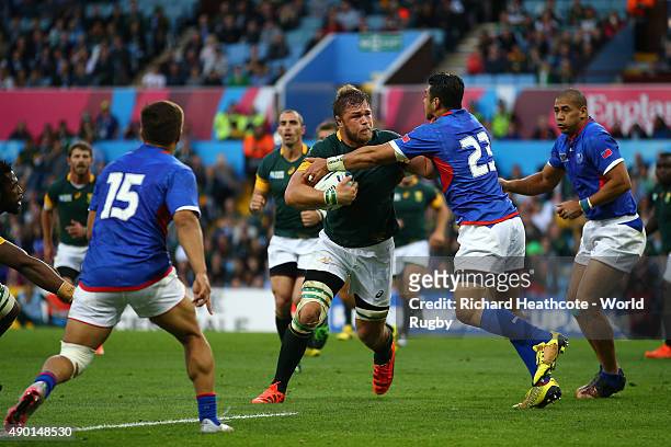 Duane Vermeulen of South Africa is tackled by George Pisi of Samoa during the 2015 Rugby World Cup Pool B match between South Africa and Samoa at...